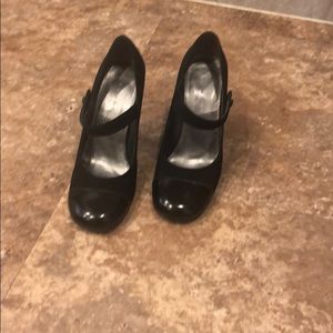 Black Mary Jane style heels.  Part patent leather.